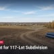 Fostoria News Construction site with pipes and open land for subdivision development.